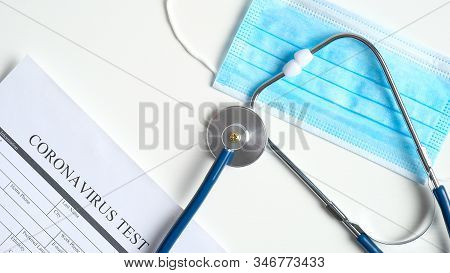 Coronavirus Blood Test Concept. Laboratory Table With Medical Form Coronavirus Test, Respiratory Mas