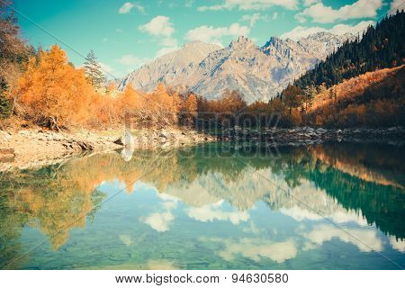 Scenery Of High Mountain With Lake And High Peak On A Clear Day