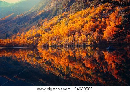 Scenery Of High Mountain With Lake And High Peak On A Clear Day