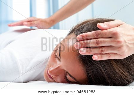 Therapists Hands Doing Reiki Therapy On Girl.