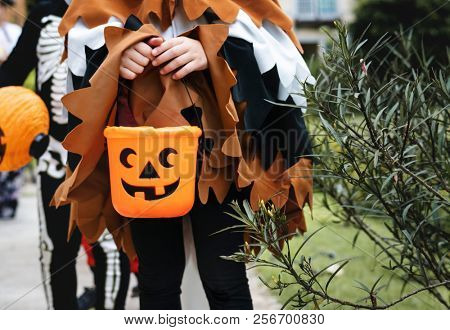 Young kids trick or treating during Halloween