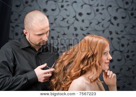 Professional Hairdresser With Fashion Model At Luxury Salon