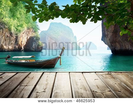 Adaman sea and wooden boat in Thailand