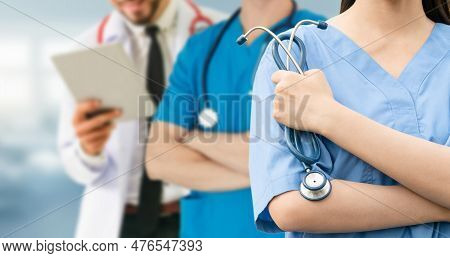 Healthcare People Group. Professional Doctor Working In Hospital Office Or Clinic With Other Doctors