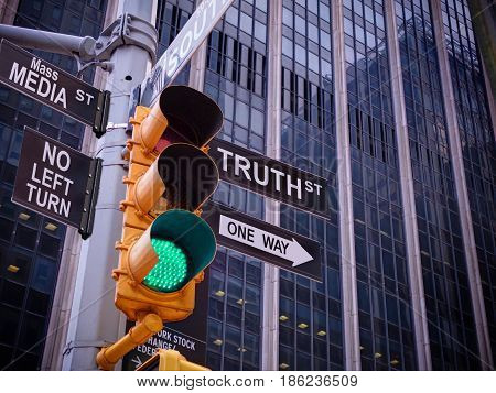 NYC Wall street yellow traffic green light black pointer guide One way to truth. No way no turn to Mass media fake news. Right Choice is truth. Mass media news concept. Politics