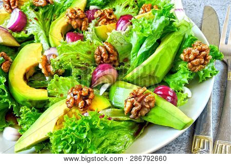 Salad With Avocado, Blue Onion And Walnut. Super Nutritious Fitness Salad With Avocado. Vegan Salad.