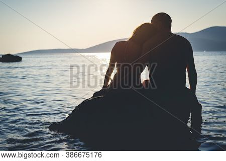 Couple On Beach In Sunset. People In Vacation. Beautiful Couple On Beach In Vacation In Sunset. Peop