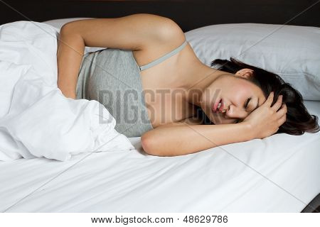 Sick Woman On Bed Concept Of Stomachache, Headache, Hangover, Sleeplessness Or Insomnia