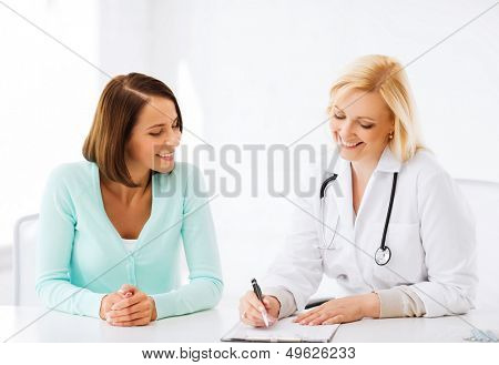 healthcare and medical concept - doctor with patient in hospital