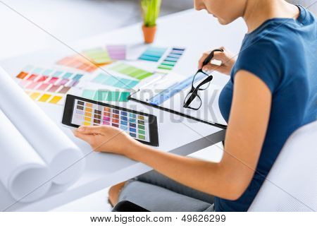 interior design, renovation and technology concept - woman working with color samples for selection