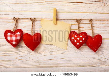 Valentines Vintage Handmade Hearts over Wooden Background.