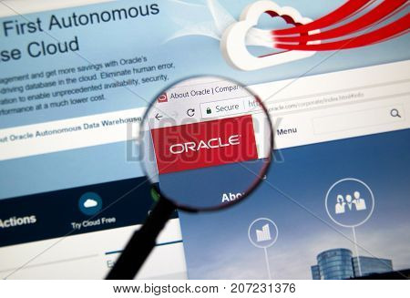 MONTREAL CANADA - OCTOBER 2 2017: Oracle home page under magnifying glass. Oracle is one of the largest vendors in the enterprise IT market.