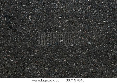 Asphalt Textured Background. Dark Asphalt Surface Texture. Abstract Close-up Of Black Backdrop. Patt