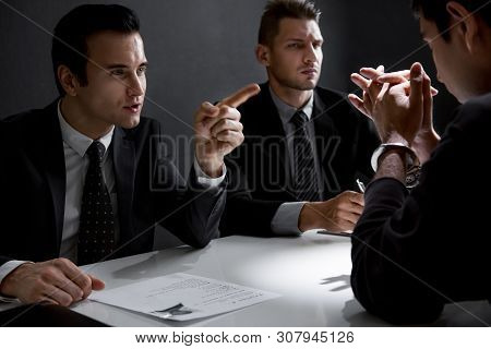 Criminal Man With Handcuffs Being Interviewed In Interrogation Room After Committed A Crime