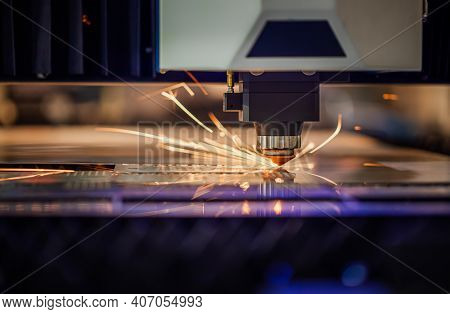 CNC Laser cutting of metal modern industrial technology. Laser cutting works by directing the output of a high-power laser through optics. Laser optics and CNC computer numerical control.