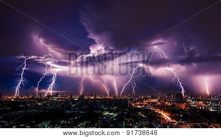 Lightning Storm Over City In Purple Light