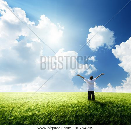 happy young man rest on wheat field