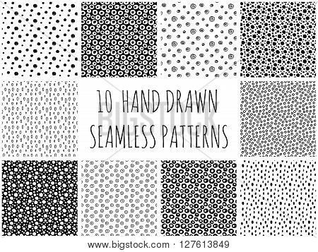 Abstract polka dot pattern set with hand drawn dots. Cute vector black and white polka dot pattern set. Seamless monochrome polka dot pattern set for fabric, wallpapers, cards and web backgrounds.