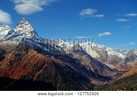 Landscape of mountains Caucasus region in Russia Mountain peaks in clouds. Caucasus. Dombay.
** Note: Visible grain at 100%, best at smaller sizes