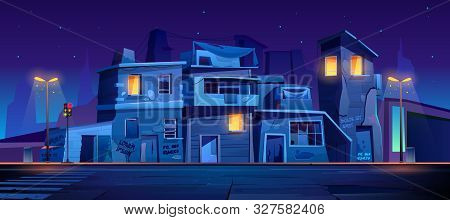 Ghetto Street At Night, Slum Ruined Abandoned Houses, Old Buildings With Glowing Windows. Dilapidate