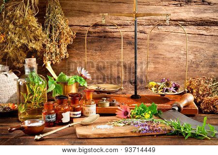 Ancient natural medicine, herbal, vials and scale on wooden background