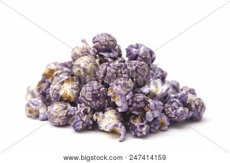 A Pile Of Puprle Candy Coated Popcorn On A White Background