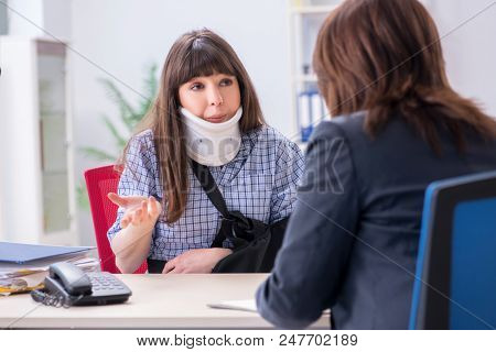 Injured employee visiting lawyer for advice on insurance