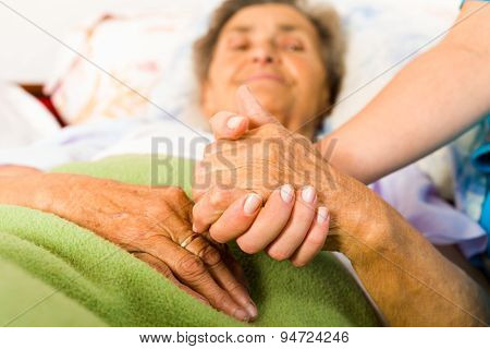 Caring Nurse Holding Hands