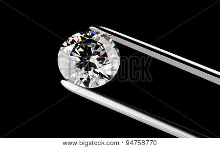 Diamond in the tweezers on a black background