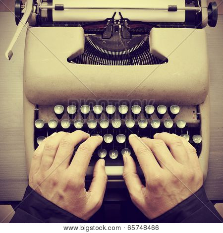 man typing on an old typewriter, with a retro effect