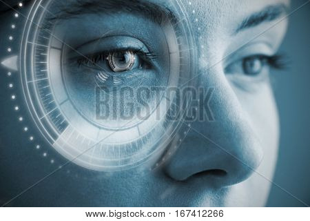 Digital composite of volume knob with graphs against beautiful eye of woman