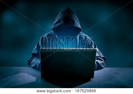 Hacker using laptop. Hacking the Internet - high resolution.