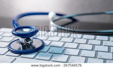 Medical Science Technology Concept. Blue Stethoscope On White Modern Keyboard On Doctor Desk. Health