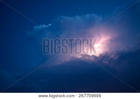 Lightnings In Storm Clouds. Peals Of A Thunder And The Sparkling Lightnings In Clouds.