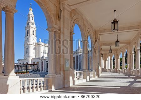 Sanctuary of Fatima, Portugal. Basilica of Our Lady of the Rosary seen from and through the colonnade. One of the most important Marian Shrines and pilgrimage locations for Catholics