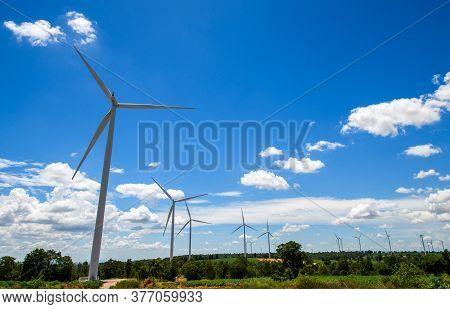 Landscape Of Windmills For Electric Power Production With White Cloud And Blue Sky At Huai Bong, Dan