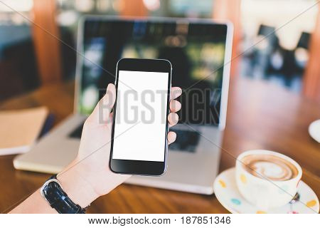 girl using smartphone in cafe. Hand holding smartphone white screen orange sunshine. smartphone vintage tone. smartphone black coler. woman using smartphone. using smartphone in coffee shop. using smartphone white screen. girl using smartphone.