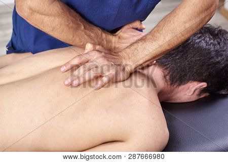 Physiotherapist Giving A Back Massage. Chiropractic, Osteopathy, Manual Therapy, Acupressure