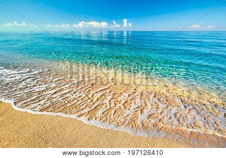 Sea view from tropical beach with sunny sky. Summer paradise beach. Tropical shore. Tropical sea. Exotic summer beach with clouds on horizon. Ocean beach relax outdoor travel