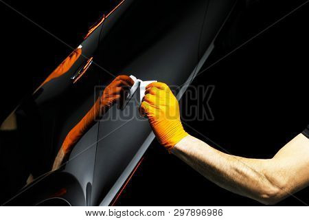 Car Polish Wax Worker Hands Polishing Car. Buffing And Polishing Vehicle With Ceramic. Car Detailing