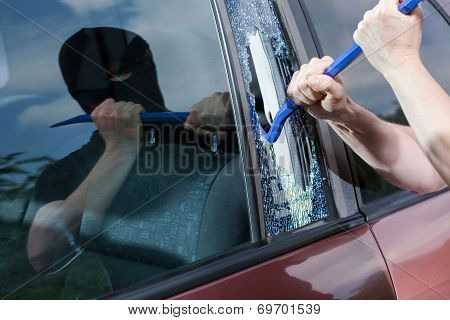 Robber With Crowbar Smashing Glass