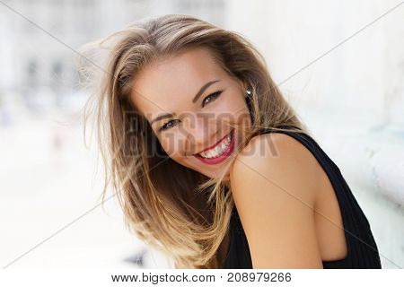 Happy young brunette carefree woman smiling outdoor portrait happiness