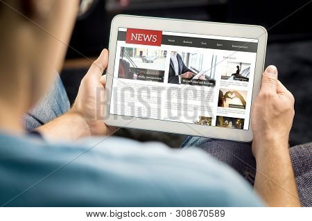 Online News Article On Tablet Screen. Electronic Newspaper Or Magazine. Latest Daily Press And Media