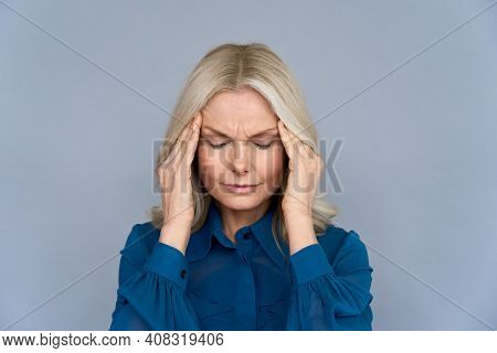 Stressed Frustrated Middle Aged Lady Suffering From Headache Massaging Temples, Close Up View. Tired