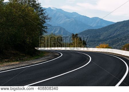 Asphalt Road. Paved Road On The Background Of Mountains. Road On The Background Of Beautiful Mountai