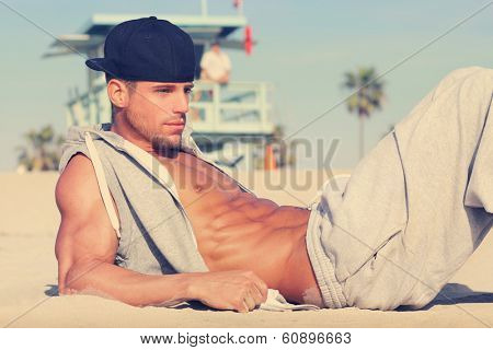 Hot young guy at the beach with very subtle retro toning