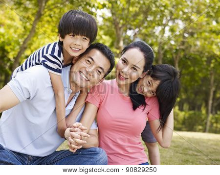 Happy Asian Family With Two Children