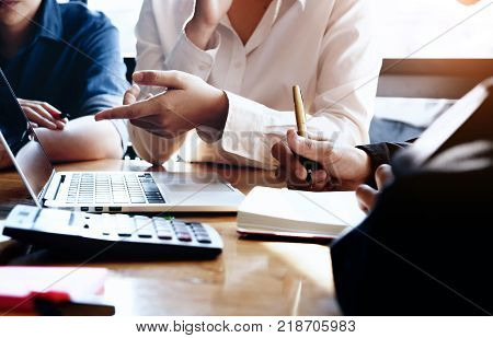 business meeting business woman Explain analyze the company's sales plan to team leader and business owner by use computer laptop calculator stock maket chart on wood desk in conferance.