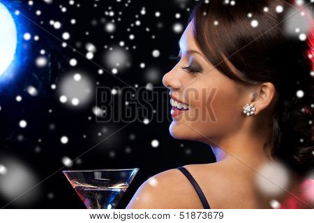 luxury, vip, nightlife, party, christmas, x-mas, new year's eve concept - beautiful woman in evening dress with cocktail