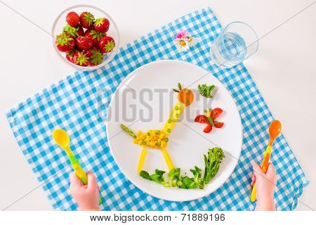 Child's Hand And Healthy Vegetable Lunch